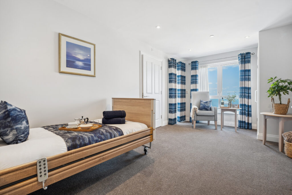 Ocean Heights Care Home bed with tray ready for breakfas